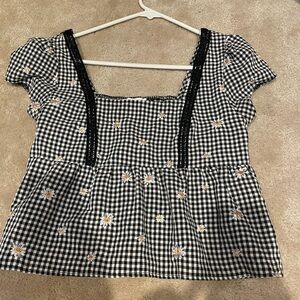 Elegant Black and White Checkered Blouse with Floral Details